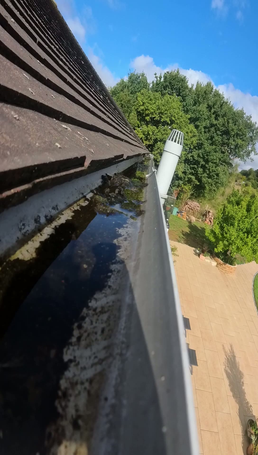 Debris and silt sitting along the gutter run at the property near High Wycombe, recorded during the video inspection