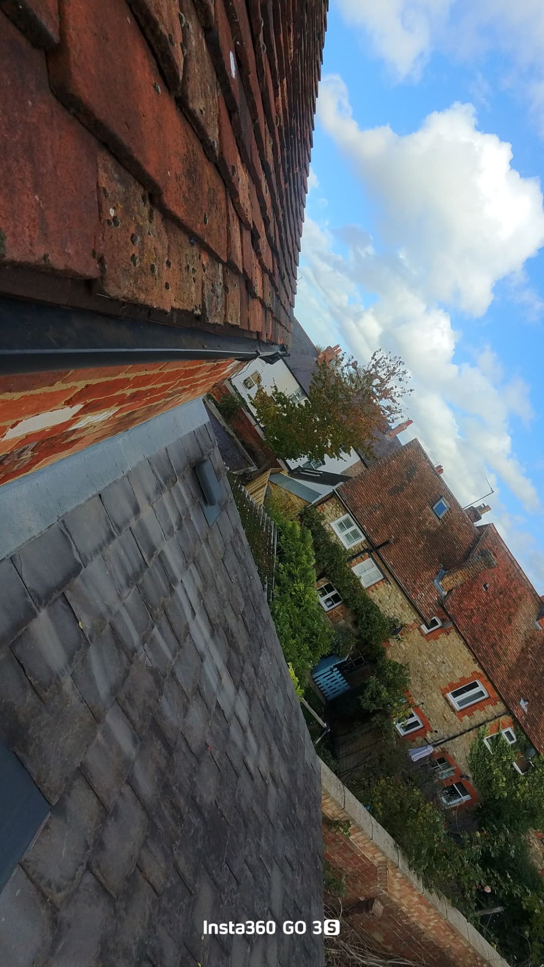 Proof photo: the cleared gutter running above the fragile slate roof on a period home in Thame town centre