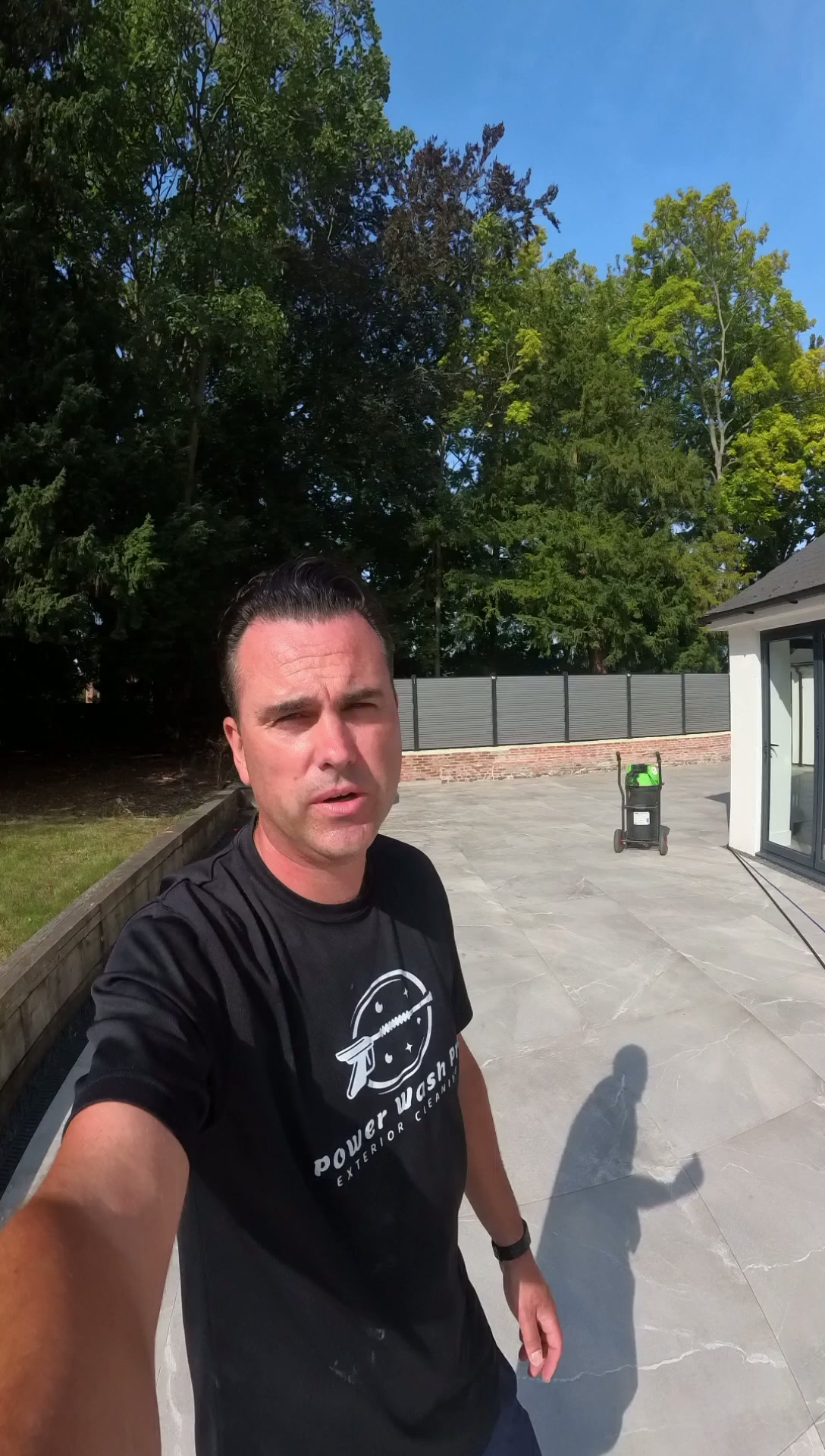 Andrew of Power Wash Pro pressure washing a customer's patio in Thame